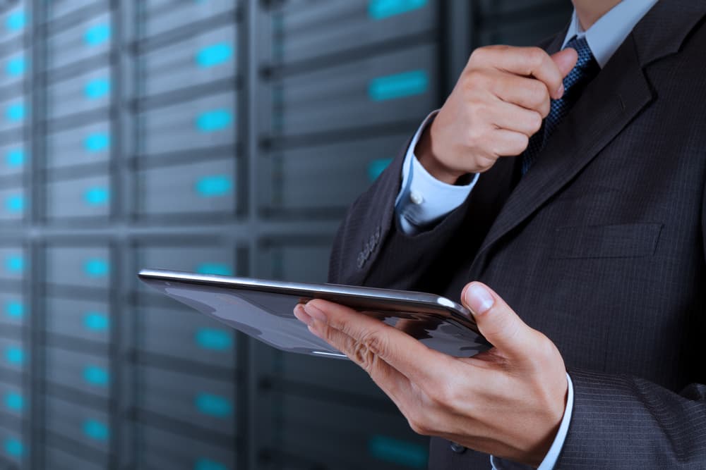 Managing cloud infrastructure on a tablet in front of a server rack